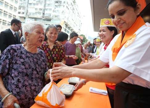 Waiting in line in Shek Kip Mei Estate for a Fairwood meal. Photo: Sam Tsang, SCMP