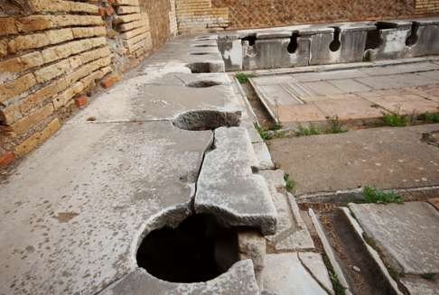 An ancient Roman lavatory in Ostia Antica, Italy.