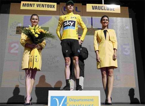 Chris Froome on the podium after the chaotic ending to the stage. Photo: Reuters