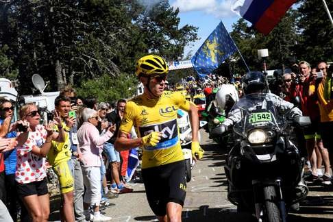 Christopher Froome runs up Mt Ventoux as he searches for a replacement bike. Photo: AFP