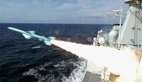 A Chinese navy vessel takes part in military drills in the South China Sea, just before the Permanent Court of Arbitration in The Hague announced its ruling on July 12. Photo: Kyodo