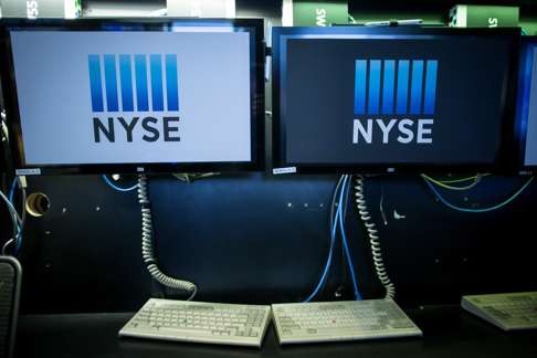 Monitors display signage on the floor of the New York Stock Exchange (NYSE) in New York as robust economic data and a rally on Wall Street could encourage the US Fed to increase interest rates later in the year. Photo: Bloomberg