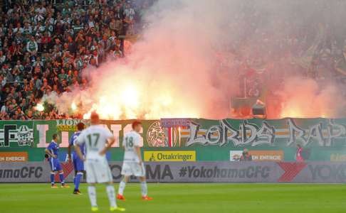 Fans with flares during the match Action Images via Reuters / Heinz-Peter Bader