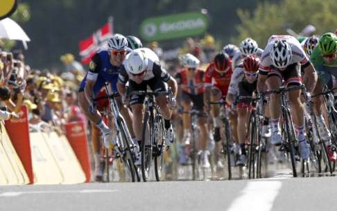 Mark Cavendish (second left) and Marcel Kittel (left) sprint to the finish line in the 14th stage of the Tour de France. Photo: AP