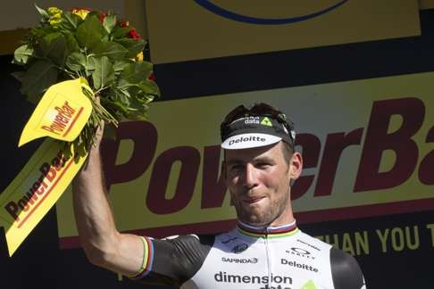 Stage winner Britain's Mark Cavendish celebrates on the podium after the fourteenth stage. AP