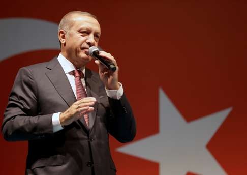 Turkish President Tayyip Erdogan addresses supporters outside of his residence in Istanbul on Tuesday. Photo: Reuters
