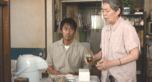 Kirin Kiki (right) and Hiroshi Abe play mother and son in After the Storm.