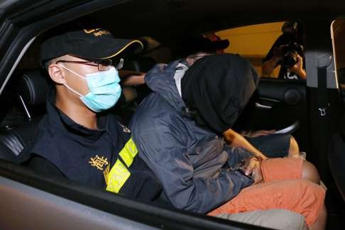 A lorry driver (right) was arrested when he tried to pick up the consignment. Photo: SCMP Pictures