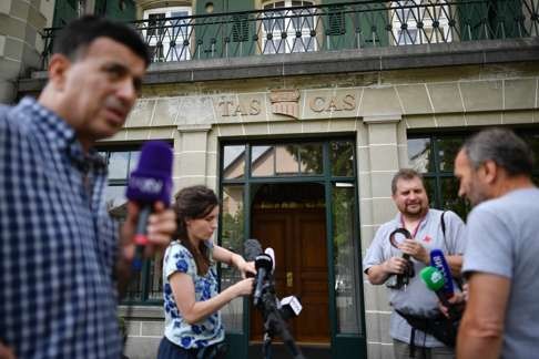 Journalists set up microphones for the statement from the Court of Arbitration for Sport on Thursday. Photo: AFP