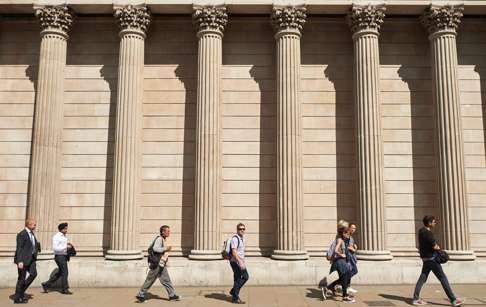 Pedestrians walk past the Bank of England in the City of London. The central bank signalled a possible August cut in interest rates in response to Britain's vote to exit the EU. Photo: AFP