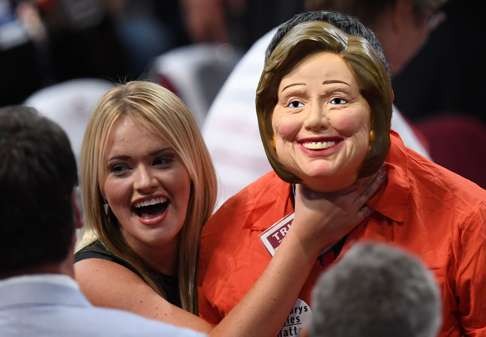 A Republican delegate dressed as US Democratic presidential candidate Hillary Clinton is “accosted” by another delegate before the start of the last day of the Republican National Convention in Cleveland, Ohio. Photo: AFP