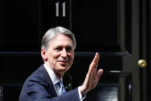 Philip Hammond, UK chancellor of the exchequer, gestures in London as signs of economic deterioration went up following the UK’s vote to leave the EU. Photo: Bloomberg