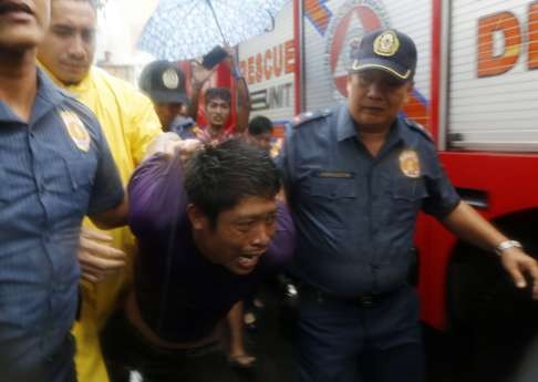 A Filipino allegedly involved with illegal drugs is arrested by police. For more than two decades Duterte was the maverick mayor of southern Davao City, where he earned a reputation as ruthless crime-fighter. Photo: EPA