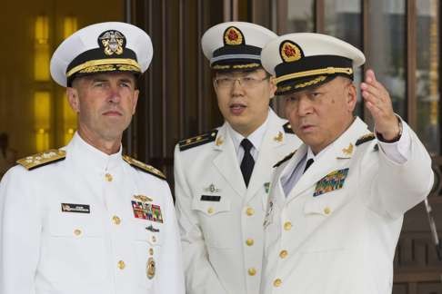 Admiral Wu Shengli, right, commander of the PLA Navy, points out the layout of the Chinese Naval Headquarters to Admiral John Richardson, left, the US Chief of Naval Operations, during a visit to Beijing . Photo: EPA