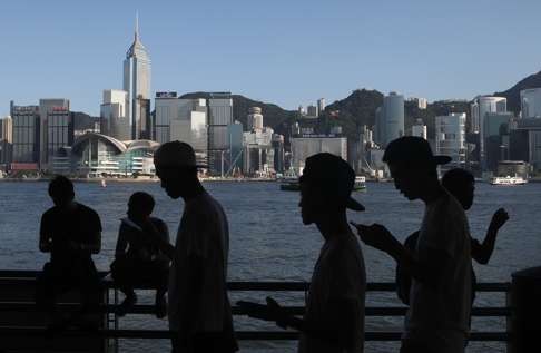 A group of fans manoeuvre their smartphones as they play Pokemon Go in Hong Kong. Photo: Kin Cheung