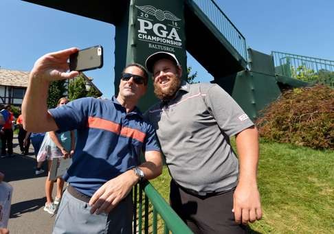 Andrew Johnston takes a photo with a fan during a practise round prior to the 2016 PGA Championship at Baltusrol Golf Club. Photo: AFP