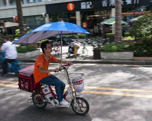 A pedelec rider in Shenzhen. Photo: Stuart Heaver