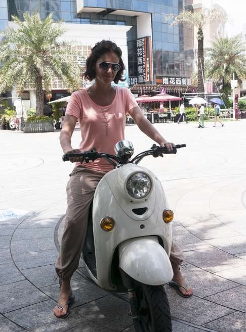 French entrepreneur Audrey Tournier on her e-bike in Shekou district in Shenzhen. Photo: Stuart Heaver