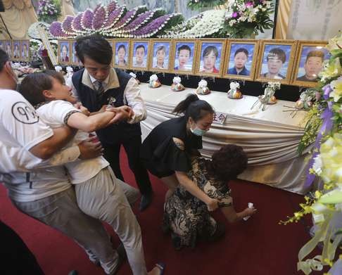 Grief-stricken relatives of one of the 24 mainland tourists who died in the fire. Photo: CNA