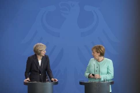 British Prime Minister Theresa May (left) and German Chancellor Angela Merkel. Photo: Bloomberg