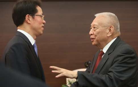 Zhang Xiaoming (left), director of the central government's liaison office, speaks to former chief executive Tung Chee-hwa at a meeting last month. Photo: Edward Wong