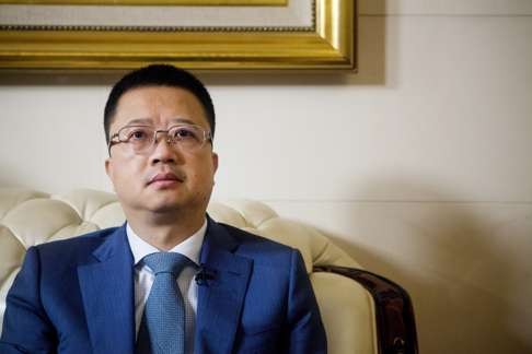 Billionaire Liang Xinjun, chief executive officer of Fosun International Ltd., sits during a Bloomberg Television interview in Shanghai, China, where Fosun Group, one of China's most acquisitive conglomerates, is preparing to sell as much as 40 billion yuan ($6 billion) in assets as it turns its focus towards raising its credit rating to above junk. Photo: Bloomberg