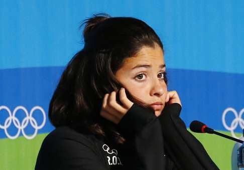 Syrian swimmer Yusra Mardini attends a press conference of the Olympic refugee team prior to the Rio 2016 Olympic Games in Rio de Janeiro, Brazil, 02 August 2016. Ten refugee athletes including two Syrian swimmers will form a team set to compete in the Rio 2016 Olympics, which will take place from 05 August until 21 August 2016 in Rio de Janeiro. EPA/LARRY W. SMITH