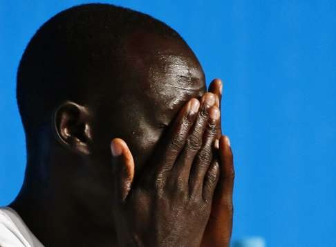 James Chiengjiek from South Sudan reacts during a press conference of the Olympic refugee team prior to the Rio 2016 Olympic Games in Rio de Janeiro, Brazil, 02 August 2016. Ten refugee athletes including five runners from South Sudan will form a team set to compete in the Rio 2016 Olympics, which will take place from 05 August until 21 August 2016 in Rio de Janeiro. EPA/LARRY W. SMITH