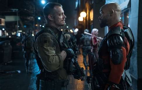 Joel Kinnaman (left) as Rick Flag and Will Smith as Deadshot in a scene from the film.