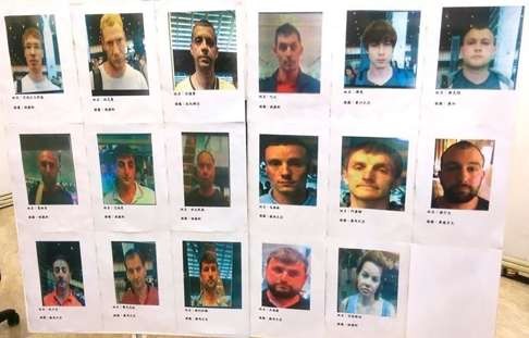 Taiwanese police displayed photographs of the 17 suspects. Photo: SCMP Pictures