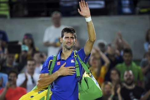 Novak Djokovic reacts after losing against Juan Martin Del Potro. Photo: Reuters