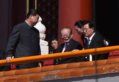 President Xi Jinping walks past former Chinese presidents Jiang Zemin and Hu Jintao (right) as he prepares to deliver his speech at the start of a military parade in Tiananmen Square on September 3, 2015. Photo: AFP