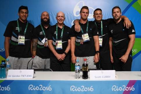 Reiko Ioane (left), DJ Forbes, coach Sir Gordon Tietjens, Scott Curry, Sonny Bill Williams, and Tim Mikkelson of New Zealand's Olympic rugby sevens team. Photo: AFP