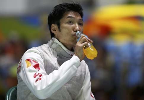 Lei Sheng (CHN) of China (PRC) has a drink. REUTERS/Issei Kato