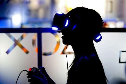 A gamer wears a VR game console during the 2016 Taipei game show in Taiwan in January. Photo: EPA