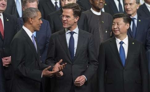 US President Barack Obama and President Xi Jinping flank Dutch Prime Minister Mark Rutte at the 2016 Nuclear Security Summit in Washington in April. Photo: EPA