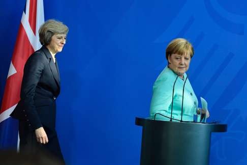 British Prime Minister Theresa May (left) and German Chancellor Angela Merkel prepare to address a press conference in Berlin. The Europeans are still preoccupied with the full implications of Brexit. Photo: AFP