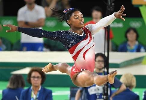 US gymnast Simone Biles is stealing the show in Rio. She led the Americans to gold in the artistic team event. Photo: TNS