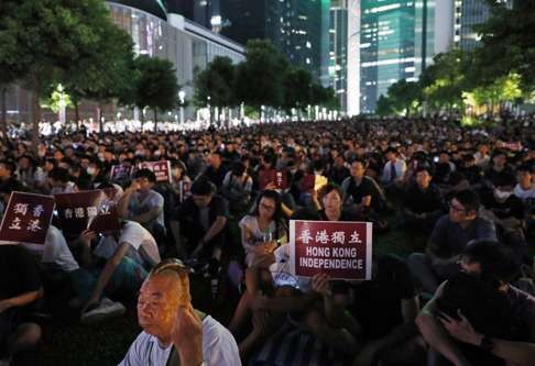 Hongkongers join a rally outside government headquarters to call for independence. Supporters of independence are very much in a minority but the government, through its actions, is ensuring that their numbers grow. Photo: AP
