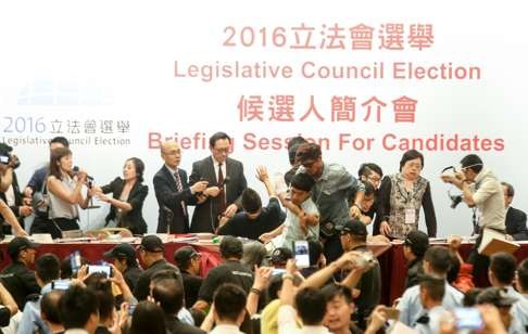 The briefing session for candidates for the September polls descended into chaos when pan-democrats and localists staged a protest after Edward Leung’s application to run was rejected. Leung, generally regarded as a supporter of independence, was tipped to win a seat next month. Photo: David Wong
