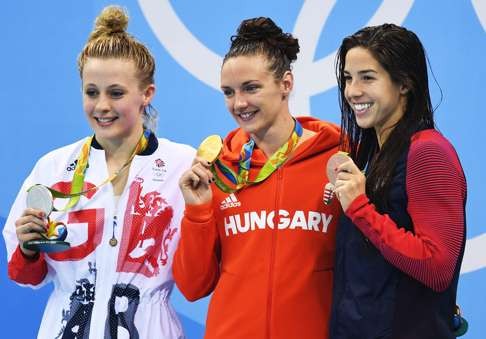 Katinka Hosszu (centre) of Hungary is flanked by Siobhan-Marie O'Connor (left) of Great Britain and Maya Dirado of the US during the medal ceremony for the women's 200m individual medley final. Photo: EPA