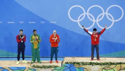 Gold medallist Joseph poses with joint silver medallists Michael Phelps, Chad Le Clos and Laszlo Cseh. Photo: Reuters
