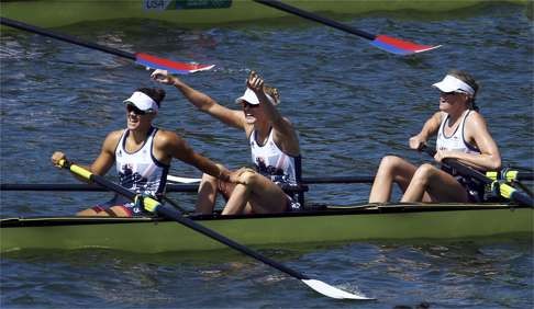Melanie Wilson lifts her arms in celebration for Britain. Photo: Reuters