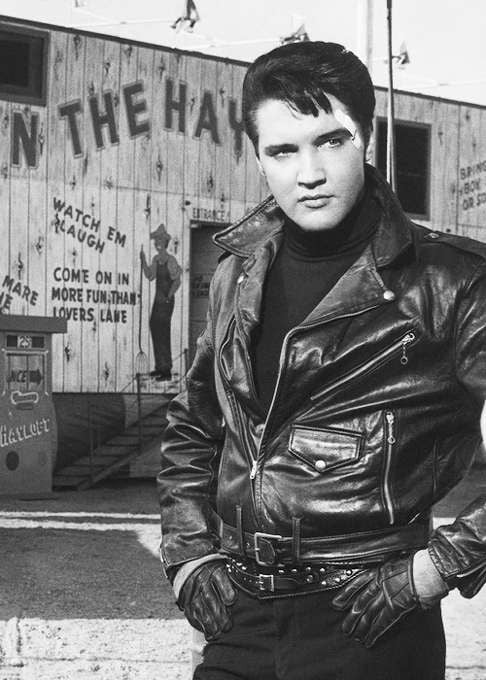 Elvis in black leather became a common sight. Here he wears it well in the 1964 film, Roustabout.
