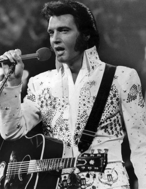 And equally comfortable in big collars and glitter – and sideburns. Photo: AP