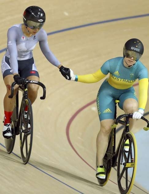 Hong Kong’s Sarah Lee and Australia’s Anna Meares hold hands after their race. Photo: Reuters