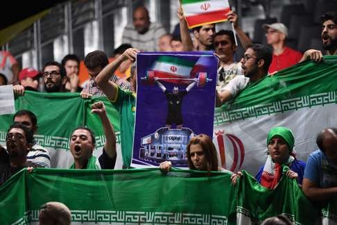 Behdad Salimikordasiabi’s supporters create a ruckus after the controversial decisions. Photo: AFP