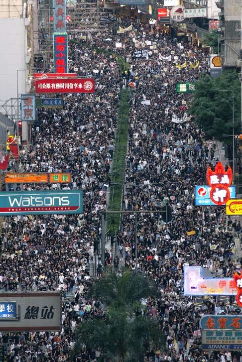 Crowds rally from Victoria Park to the Central Government Offices to protest against Article 23 on July 1, 2003. Photo: Martin Chan