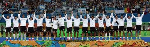 Argentina rise on the podium for the medals ceremony. Photo: AP