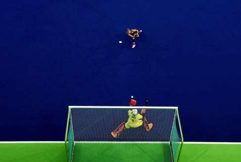 Britain’s goalkeeper Maddie Hinch makes a save from Netherland’s Maartje Paumen during the gold medal match. Photo: AFP